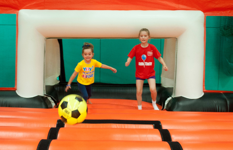 Children playing on inflatable